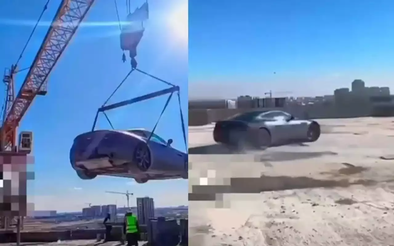 Шымкентте ер адам көпқабатты үйдің үстіне көлігін кранмен шығарып, дрифт жасаған (ВИДЕО)